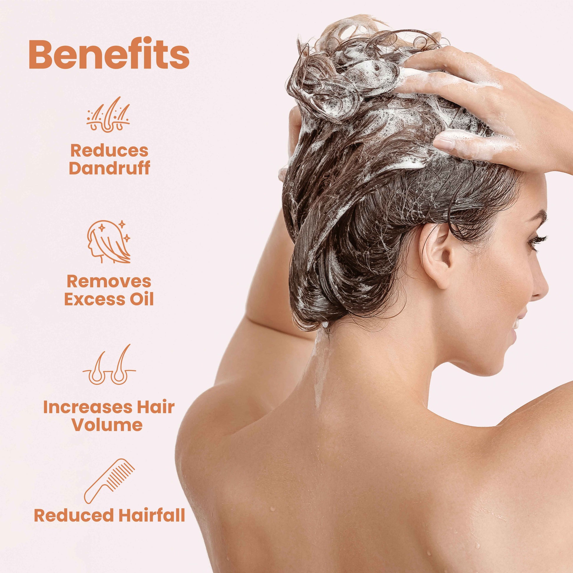 Woman washing her hair with bio valley cedarwood shampoo